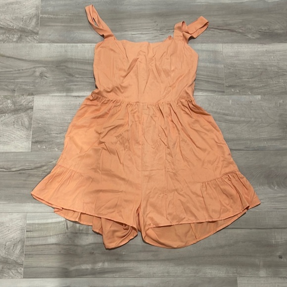 Pants - Orange romper with ruffle detail and tie back
